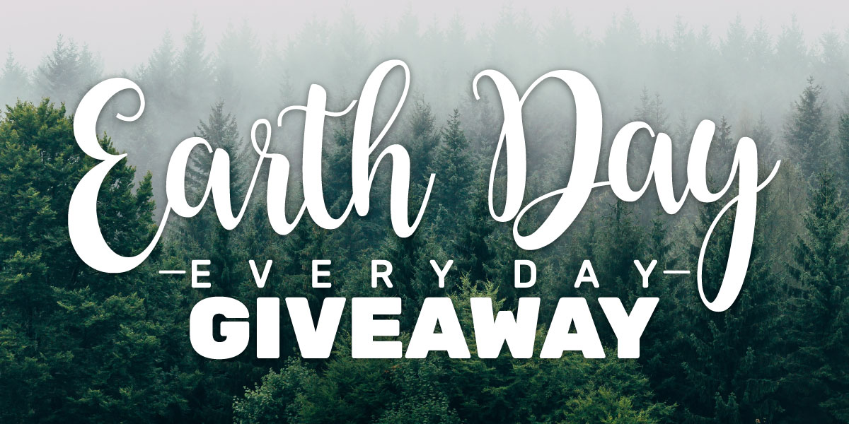 Earth day giveaway logo with foggy pines background